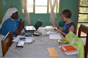 Sister Janepha and Anne working together on budgets.