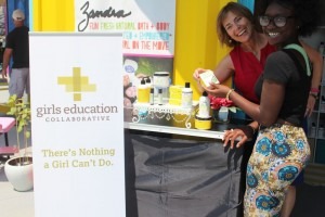 Zandra Beauty founder Zandra Cunningham (front) shows GEC executive director Anne Robinson Wadsworth the Lemon Tea Tree product line